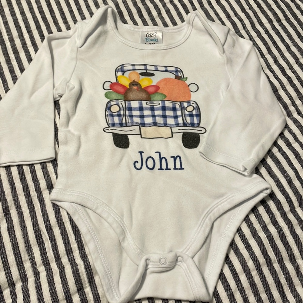 Long sleeve onesie. Fall/thanksgiving theme. John.